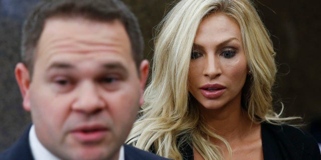Lindy Lou Layman, right, stands with her defense attorney Justin Keiter after making an appearance in court.