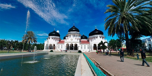 Pictured is the Banda Aceh Grand Mosque where two Christians were flogged under sharia law, accused of gambling.
