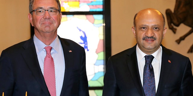 Oct. 21, 2016: U.S Secretary of Defense Ash Carter, left, and his Turkish counterpart Fikri Isik pose for a photo before a meeting at the Defense Ministry in Ankara