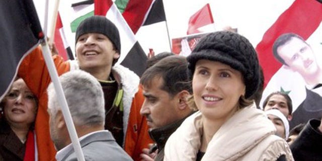 Jan. 11, 2012: Asma, the wife of Syrian President Bashar al-Assad, makes an appearance during a rally in support of her husband in Damascus.