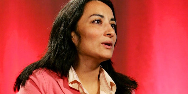 American Muslim journalist and single mother Asra Nomani during an interview with Reuters in New York, April 6, 2005. Nomani, whose first book was about tantric sex, and is used to being told she is a "criminal" by those of her faith who say they know best, is determined to fight back saying "we have to rewrite modern day history so that Islam can turn a page and join the rest of the world with social justice and equity as our greatest defining factors not fear and persecution and repression." REUTERS/Mike Segar/FEATURE/RELIGION-ISLAM-WOMAN MS - RTR7CE2