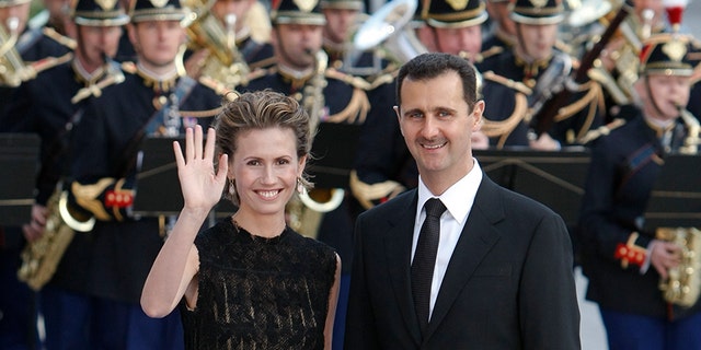 July 13, 2008: Syria's President Bashar Al-Assad and wife Asma arrive at a dinner during a EU-Mediterranean summit in Paris.
