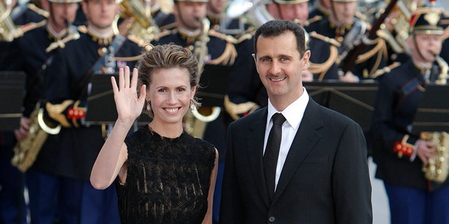July 13, 2008: Syria's President Bashar Al-Assad and wife Asma arrive at a dinner during a EU-Mediterranean summit in Paris.
