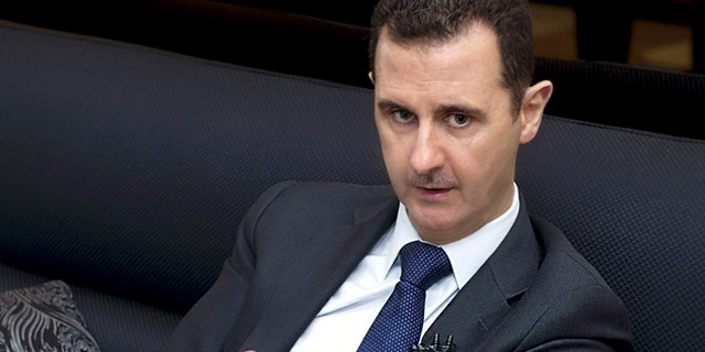 June 17, 2013: Syria's President Bashar al-Assad speaks during an interview with a German newspaper in Damascus, in this handout photograph distributed by Syria's national news agency SANA. (Reuters)