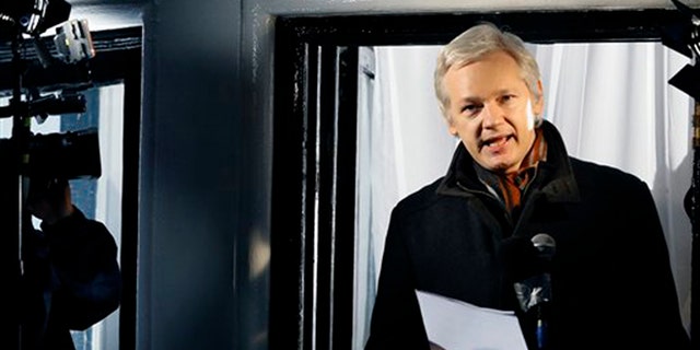 In this Thursday, Dec. 20, 2012, file photo, Julian Assange, founder of WikiLeaks speaks to the media and members of the public from a balcony at the Ecuadorian Embassy in London. (AP Photo/Kirsty Wigglesworth, File)