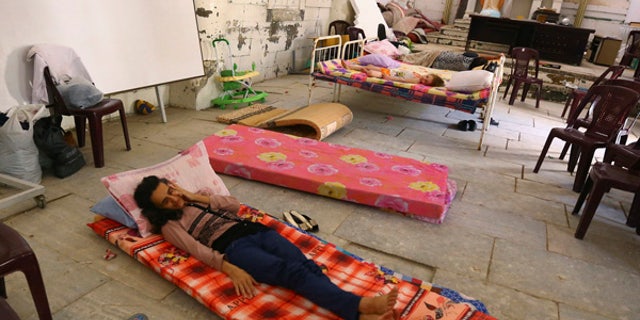 July 20, 2014: An Iraqi Christian family fleeing the violence in the Iraqi city of Mosul, sleeps inside the Sacred Heart of Jesus Chaldean Church in Telkaif near Mosul, in the province of Nineveh.