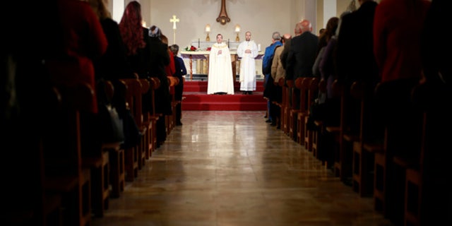Iraqi Christians attend a mass on Christmas at St. Joseph Chaldean church in Baghdad, Iraq, Dec. 25, 2016.