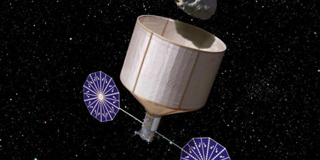 An artist's illustration of an asteroid retrieval spacecraft capturing a 500-ton asteroid that is about 7 meters wide.