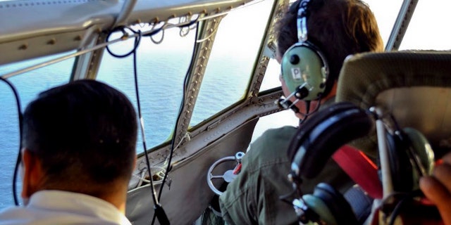 In this Tuesday, Nov. 21, 2017 photo released by the Argentine Navy on Nov. 22, members of the Argentine Air Force search for a missing submarine in the South Atlantic near Argentina's coast.