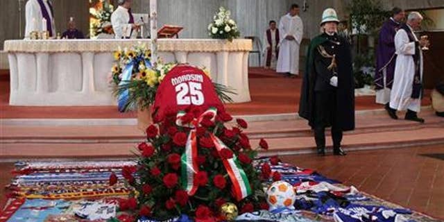 The coffin of Livorno's soccer player Piermario Morosini is seen during his funeral in Bergamo April 19, 2012. REUTERS/ANSA/Pool