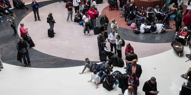Travelers were stuck at the Hartsfield-Jackson airport after a power outage grounded more than 1,000 flights on Sunday.