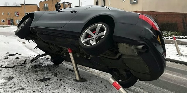This is the unbelievable moment in which a black Audi is frozen mid air after veering off the road and colliding with a metal post on a frost covered pavement. See Masons story MNAUDI; The picture shows a freeze-frame moment which looks like it is from an action movie with the car caught in the air at a seemingly impossible angle. Beds Cambs Herts Road Policing Unit said the suspected driver was standing by his car when they arrived and blew a breath test of almost double the drink drive limit. BCH Road Policing said on Twitter: "2nd Job this morning in #Peterborough, suspected driver stood next to his car blew 72ugl roadside, driver on way to #custody for evidential readings." No-one was injured in the crash. Cambs police have been contacted for comment.
