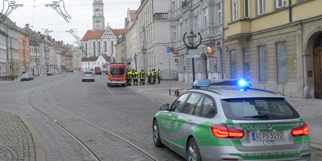 Dec. 25, 2016: A police vehicle drives through an almost empty street in Augsburg, Germany.