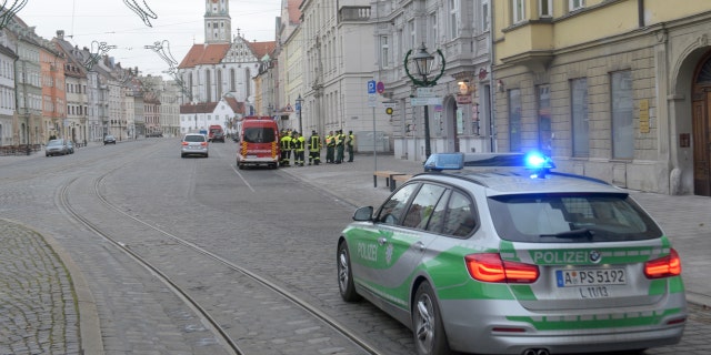 Dec. 25, 2016: A police vehicle drives through an almost empty street in Augsburg, Germany.