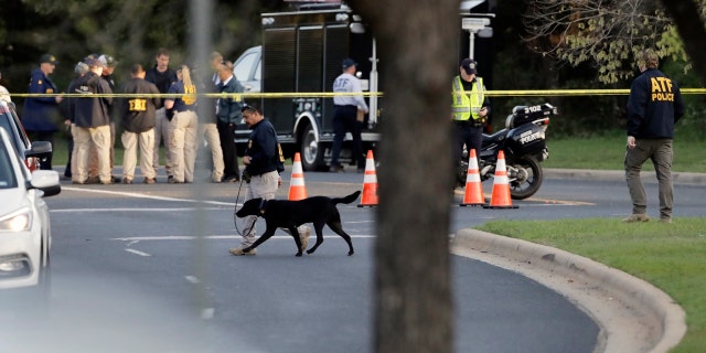 Officials work and stage near the site of Sunday's explosion on March 19, 2018, in Austin, Texas.