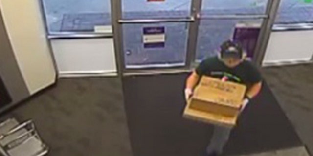 Surveillance photos show Mark Anthony Conditt dropping off two suspicious packages on Sunday from inside a South Austin FedEx Office store, where authorities said he shipped the two items with explosive devices inside.