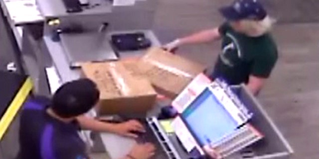 Surveillance photos show Mark Anthony Conditt dropping off two suspicious packages on Sunday from inside a South Austin FedEx Office store, where authorities said he shipped the two items with explosive devices inside.