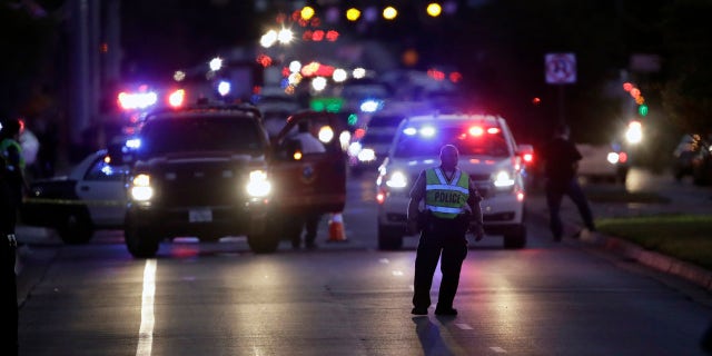 Emergency vehicles stage near the site of another explosion, Tuesday, March 20, 2018, in Austin, Texas.