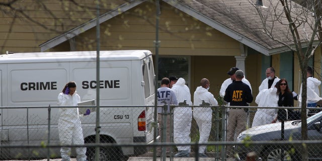 Law enforcement personnel investigate the home where Austin serial bomber Mark Anthony Conditt lived in Pflugerville, Texas, U.S., March 22, 2018.