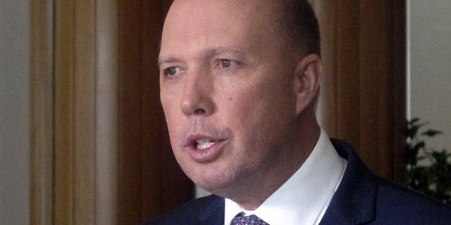 Australia’s Immigration and Border Protection Minister Peter Dutton speaks to reporters at Parliament House in Canberra, Australia (AP)