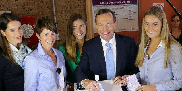 Sept. 7, 2013: Australia's opposition leader Tony Abbott, second right, and his family, from right, Bridget, Frances, wife Margaret and Louise cast their ballots at Freshwater Surf Club in Sydney, Australia.