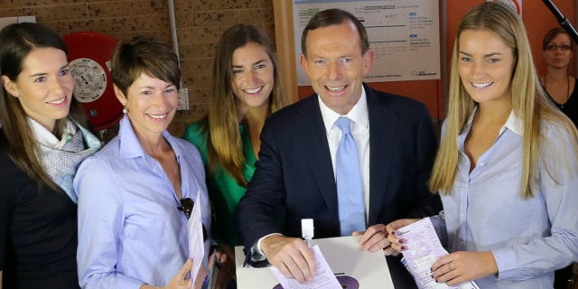 Sept. 7, 2013: Australia's opposition leader Tony Abbott, second right, and his family, from right, Bridget, Frances, wife Margaret and Louise cast their ballots at Freshwater Surf Club in Sydney, Australia.
