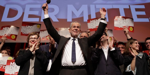 Presidential candidate Alexander Van der Bellen, a former leading member of the Greens Party, celebrates on the podium at a party of his supporters in Austria's capital Vienna Sunday, Dec. 4, 2016, after the first official results from the Austrian presidential election showed left-leaning candidate Alexander Van der Bellen with what appears to be an unbeatable lead over right-winger Norbert Hofer. (AP Photo/Matthias Schrader)