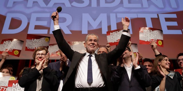 Presidential candidate Alexander Van der Bellen, a former leading member of the Greens Party, celebrates on the podium at a party of his supporters in Austria's capital Vienna Sunday, Dec. 4, 2016, after the first official results from the Austrian presidential election showed left-leaning candidate Alexander Van der Bellen with what appears to be an unbeatable lead over right-winger Norbert Hofer. (AP Photo/Matthias Schrader)