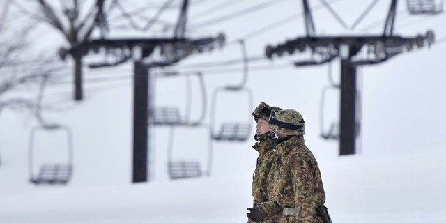 Japan's Self-Defence Forces members take part in rescue work at a ski resort nearby Kusatsu-Shirane volcano in Kusatsu, Gunma Prefecture, northwest of Tokyo, in this photo taken by Kyodo on January 23, 2018.