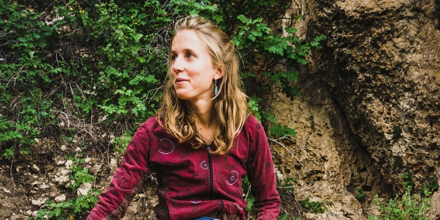 In this undated photo provided by Louis Arevalo, Inge Perkins puts on her shoes before casting off on Cowboy King in Wild Iris, Wyo. Gallatin County sheriff's officials say Perkins was skiing with her boyfriend Hayden Kennedy on Imp Peak on Saturday, Oct. 7, 2017, when they triggered an avalanche in a steep, narrow gulley. Perkins, was buried by the 150-foot-wide slide. Kennedy, who was partially buried, pulled himself free and hiked out for help after he couldn't find his girlfriend. (Louis Arevalo via AP)