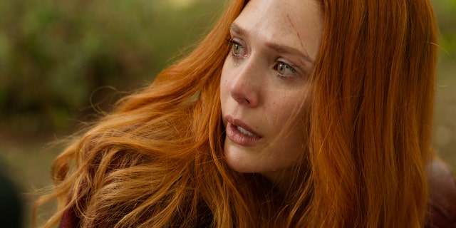 This image released by Disney shows Elizabeth Olsen in a scene from Marvel Studios' "Avengers: Infinity War."