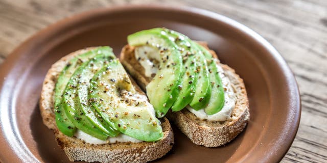 Toasts with tahini sauce and sliced avocado