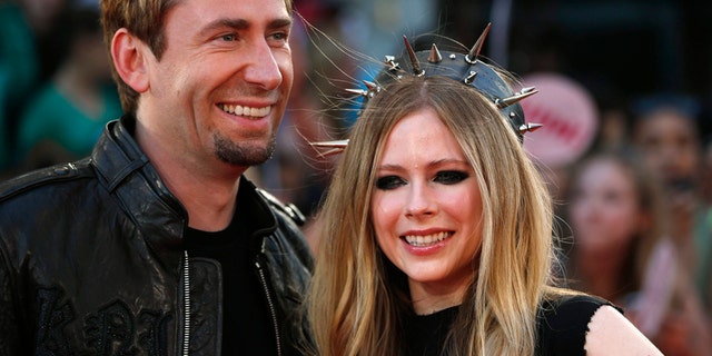Singers Avril Lavigne and Chad Kroeger arrive on the red carpet for the Much Music Video Awards on June 16, 2013, in Toronto, Canada.