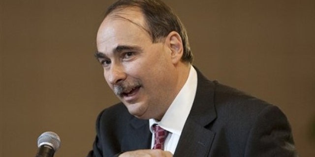 David Axelrod reaches for his glasses as he speaks at the University of Nebraska-Lincoln, in Omaha, Neb., Oct. 9. (AP Photo)