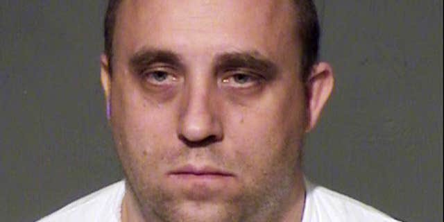 March 26, 2015: This law enforcement booking photo from the Maricopa County, Ariz., sheriff's office shows John Leo Davis.