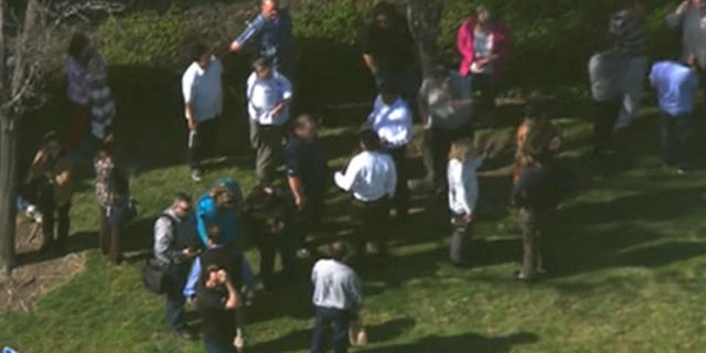 Emergency crews respond to reports of a suspicious package outside a federal building in Alameda, Calif.