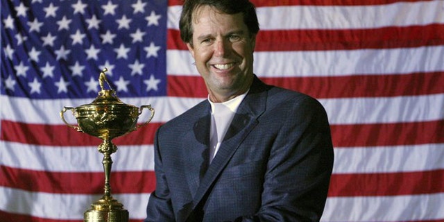 U.S. team captain Paul Azinger holds the Ryder Cup after defeating the European team to win the 37th Ryder Cup Championship at the Valhalla Golf Club in Louisville, Ky., in this Sept. 21, 2008 file photo.
