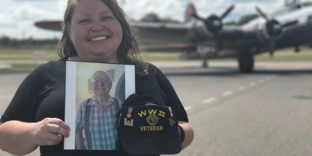 Erin Creed holds a photo of her Grandfather Dan Creed who fought in Europe during WWII. Columbia, S.C.