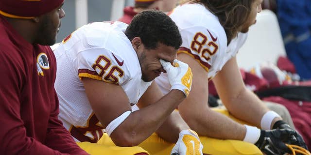 Washington Redskins tight end Jordan Reed reacts on the sidelines at the end of an NFL football game against the Minnesota Vikings, Sunday, Nov. 2, 2014, in Minneapolis. The Vikings won 29-26. (AP Photo/Jim Mone)
