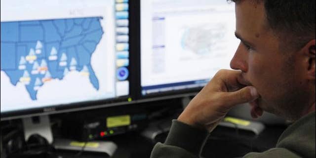 July 20, 2010: Josh Mayeux, network defender, works at the Air Force Space Command Network Operations &amp; Security Center at Peterson Air Force Base in Colorado Springs, Colorado.