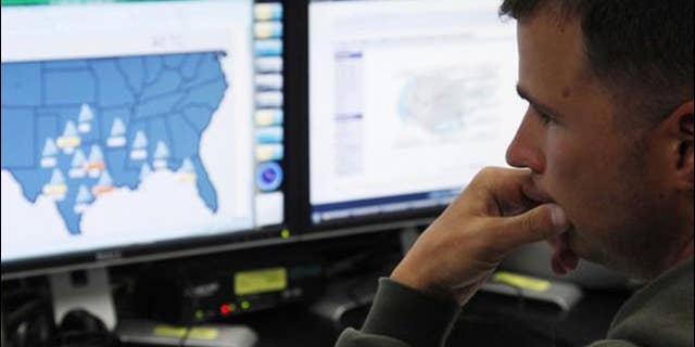 July 20, 2010: Josh Mayeux, network defender, works at the Air Force Space Command Network Operations & Security Center at Peterson Air Force Base in Colorado Springs, Colorado.
