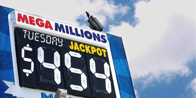 An electronic billboard displays the current Mega Millions jackpot, Tuesday, July 5, 2016, in Springfield, Ill. With slightly better odds than Powerball, it's rare that nearly four months passes without someone winning a Mega Millions jackpot, which has grown from $15 million prize to $454 million since the last winning drawing in March. (AP Photo/Seth Perlman)
