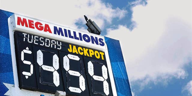 An electronic billboard displays the current Mega Millions jackpot, Tuesday, July 5, 2016, in Springfield, Ill. With slightly better odds than Powerball, it's rare that nearly four months passes without someone winning a Mega Millions jackpot, which has grown from $15 million prize to $454 million since the last winning drawing in March. (AP Photo/Seth Perlman)