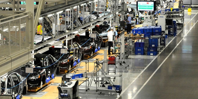 December 1, 2011:Volkswagen employees work on the assembly line of the 2012 VW Passat in Chattanooga, Tennessee.