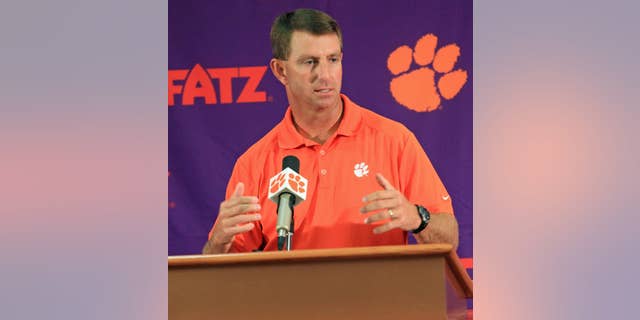 Clemson head coach Dabo Swinney discusses the Tigers' NCAA college football 2014 season at Memorial Stadium in Clemson, S.C. on Tuesday, Aug. 26, 2014. Clemson opens the season at Georgia on Aug. 30. (AP Photo/Anderson Independent-Mail, Mark Crammer)