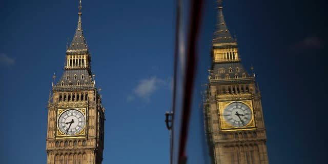 Elizabeth Tower, which houses the Big Ben bell, reflected in a bus window in London Tuesday.