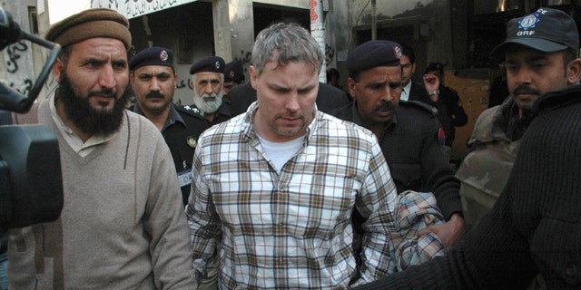 Jan. 28: Pakistani security officials escort a U.S. consulate employee, identified as Raymond Davis, to a local court in Lahore, Pakistan. Colorado authorities say Davis, accused of shooting and killing two men while working as CIA contractor in Pakistan, faces misdemeanor charges after a fight Saturday, Oct. 1, 2011, over a shopping center parking spot in Highlands Ranch, Colo.