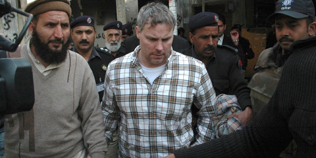 Jan. 28: Pakistani security officials escort a U.S. consulate employee, identified as Raymond Davis, to a local court in Lahore, Pakistan. Colorado authorities say Davis, accused of shooting and killing two men while working as CIA contractor in Pakistan, faces misdemeanor charges after a fight Saturday, Oct. 1, 2011, over a shopping center parking spot in Highlands Ranch, Colo.