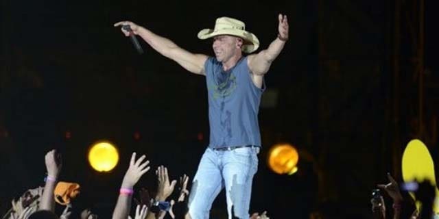 Country star, Kenny Chesney, brings the crowd to their feet.