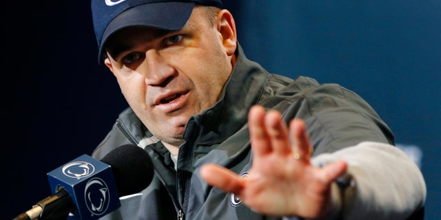 FILE - In this April 20, 2013, file photo, Penn State head coach Bill O'Brien answers questions during a news conference following their spring NCAA college football scrimmage in State College, Pa. Penn State has 67 scholarship football players on its roster and O'Brien said Wednesday, May 8, that he sees no reason why that will change significantly by the time the season starts on Aug. 31. (AP Photo/Keith Srakocic, File)